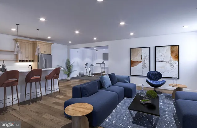 a living room with furniture kitchen view and a large window