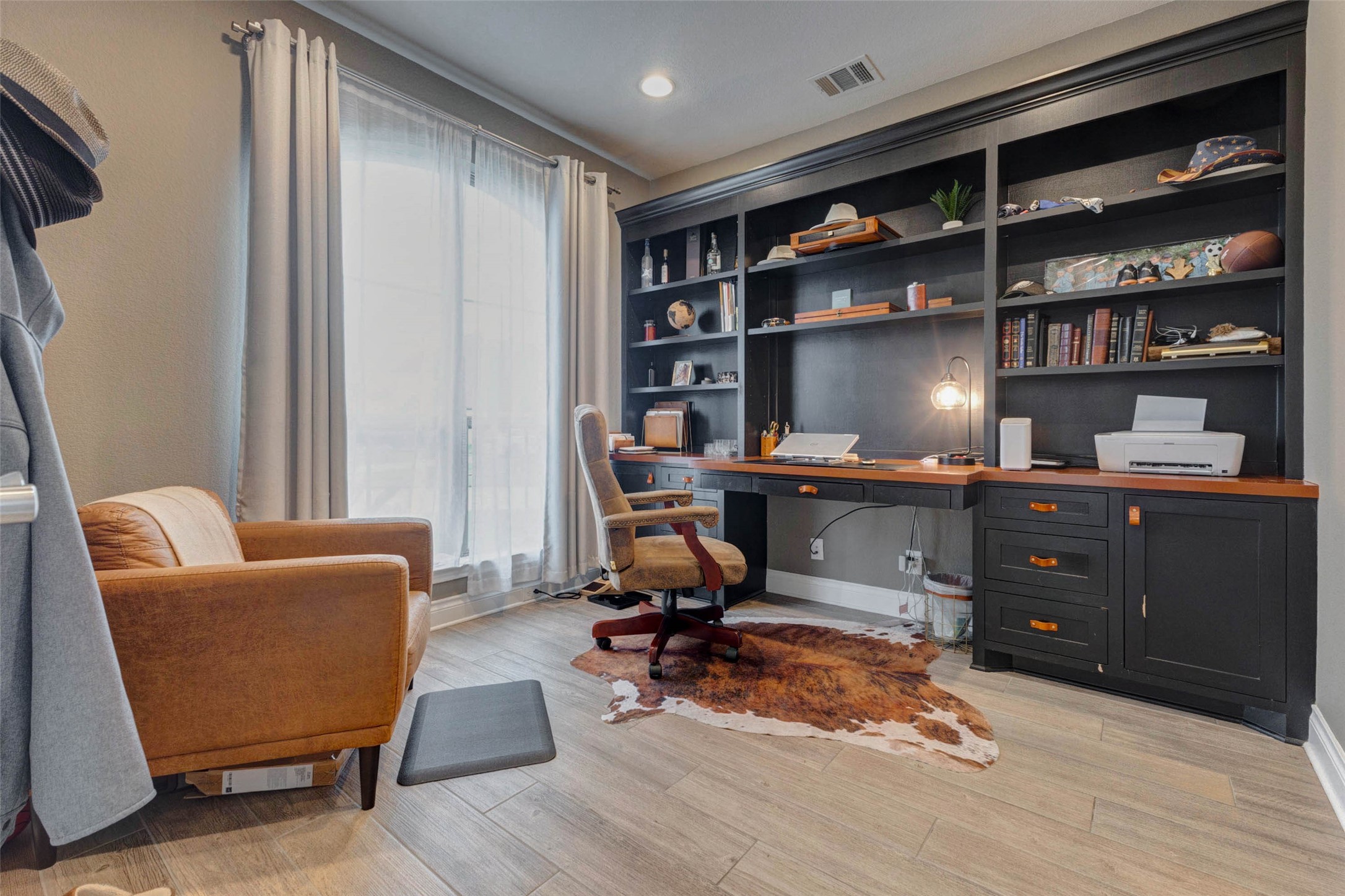 4303 Tupelo Leaf Court Manvel, TX 77578 - Photo 8 of 50 a view of a workspace with furniture and cabinet