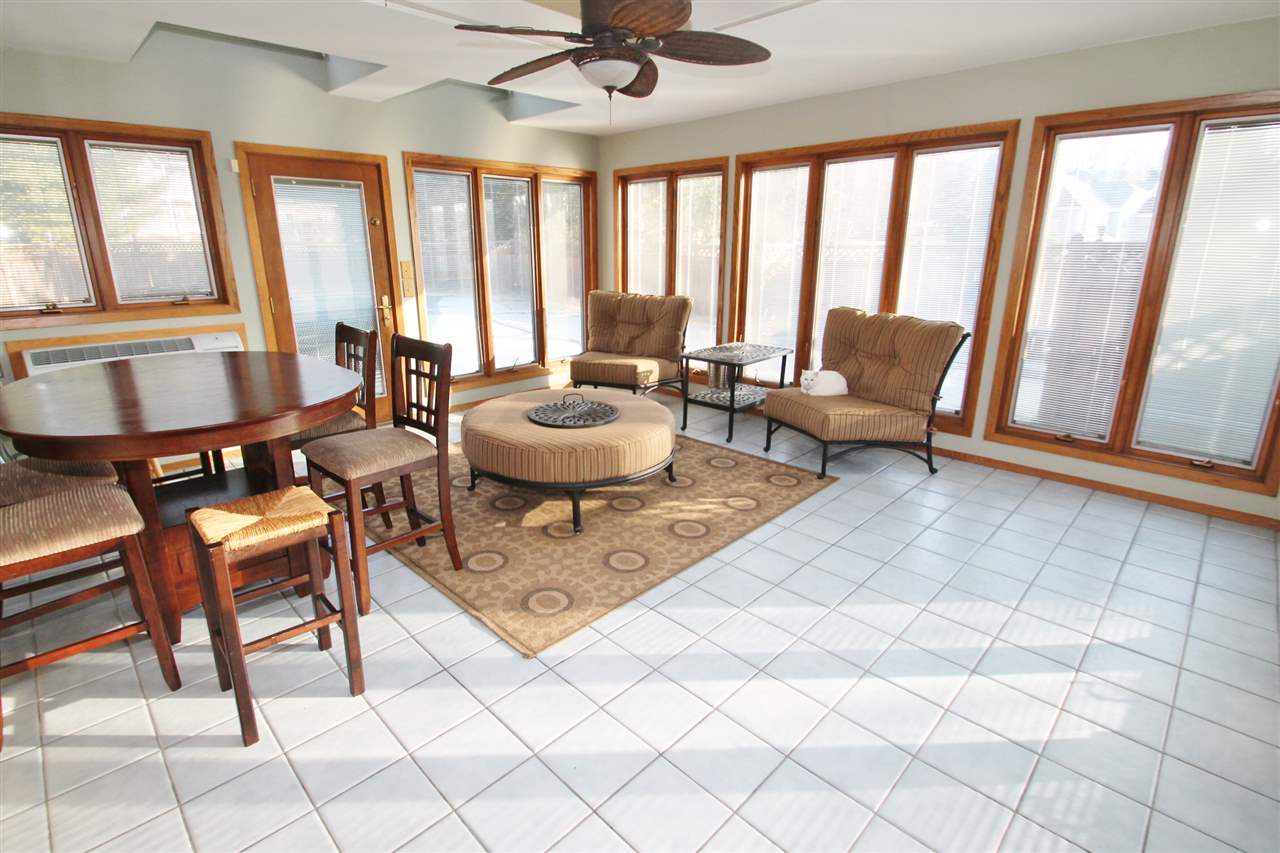 8212 Snaresbrook Road Roscoe, IL 61073 - Photo 8 of 25 a living room with furniture and a large window