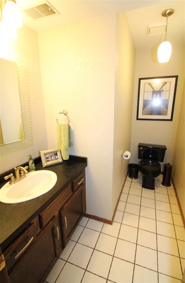 8212 Snaresbrook Road Roscoe, IL 61073 - Photo 9 of 25 a bathroom with a sink and a mirror