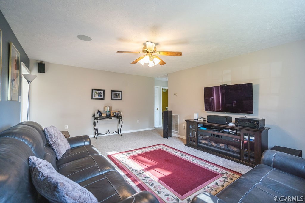 8681 Strath Road Henrico, VA 23231 - Photo 11 of 29 a living room with furniture and a flat screen tv