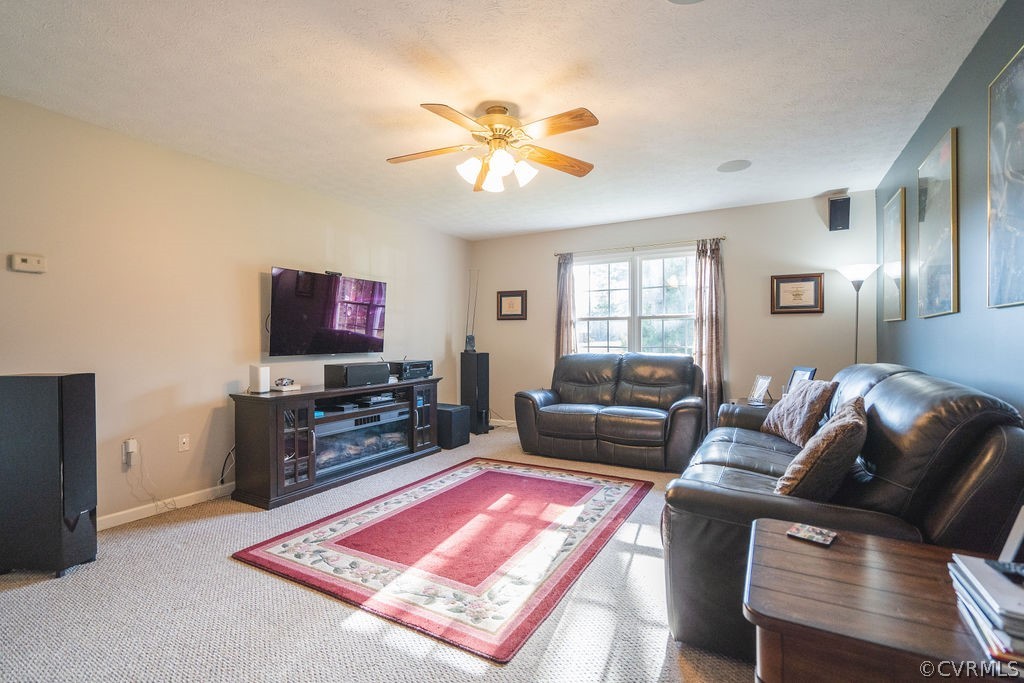 8681 Strath Road Henrico, VA 23231 - Photo 13 of 29 a living room with furniture and a flat screen tv
