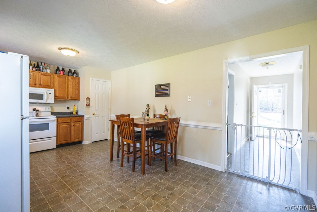 8681 Strath Road Henrico, VA 23231 - Photo 15 of 29 a view of a dining room kitchen and a window