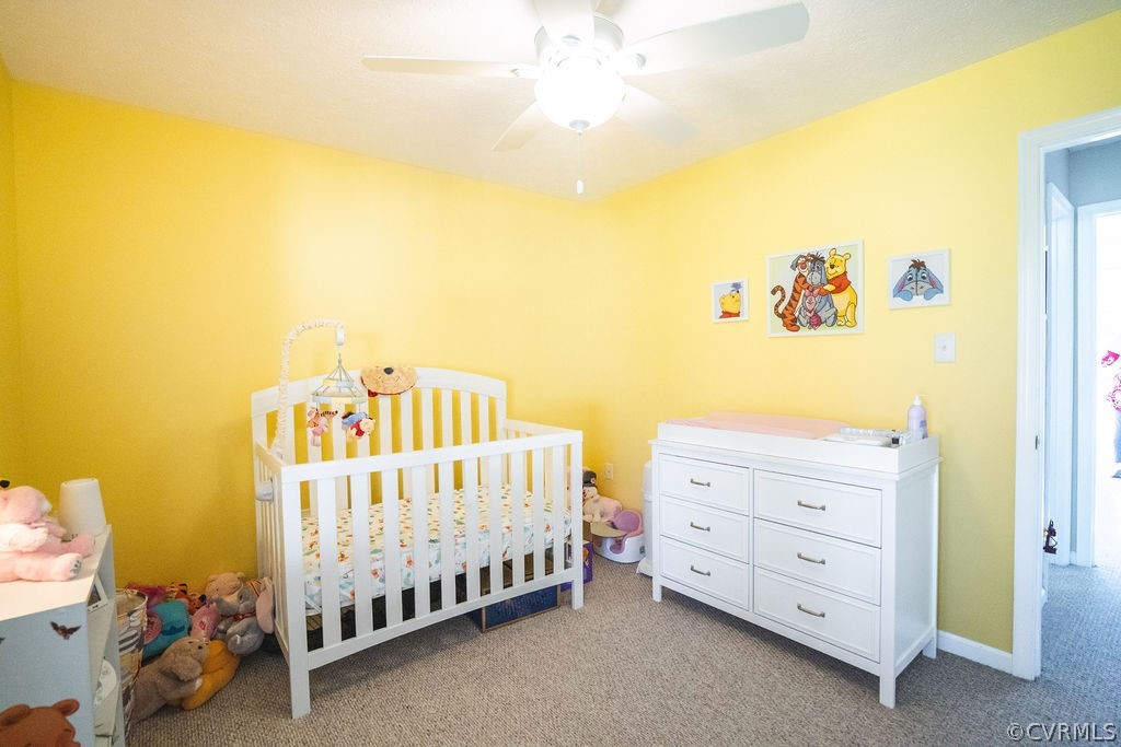 8681 Strath Road Henrico, VA 23231 - Photo 18 of 29 a bedroom with a bed and a baby crib