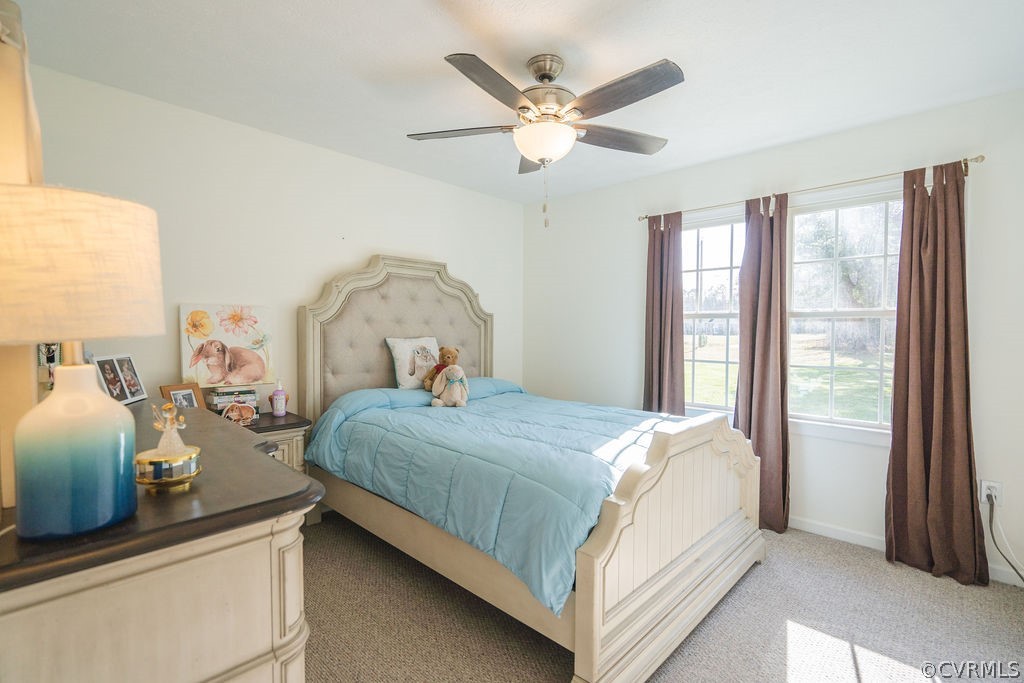 8681 Strath Road Henrico, VA 23231 - Photo 22 of 29 a bedroom with a bed and a large window