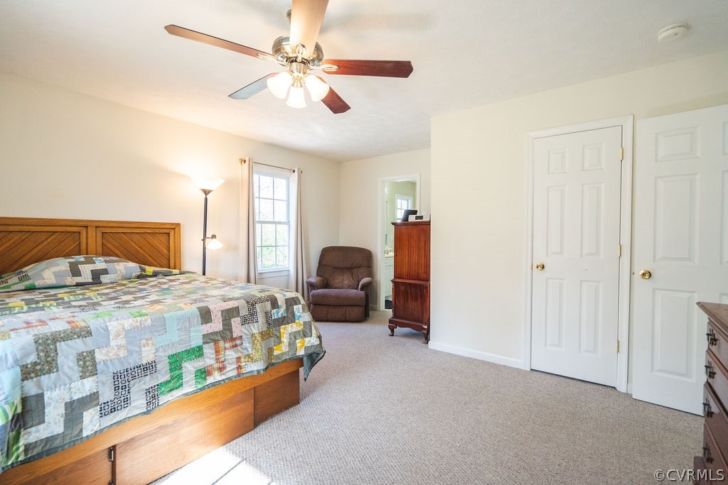 8681 Strath Road Henrico, VA 23231 - Photo 24 of 29 a bedroom with a bed closet and window