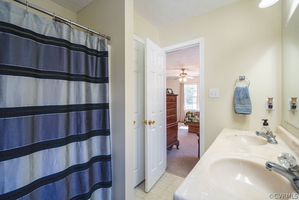 8681 Strath Road Henrico, VA 23231 - Photo 27 of 29 a en suite bathroom with a sink and a mirror