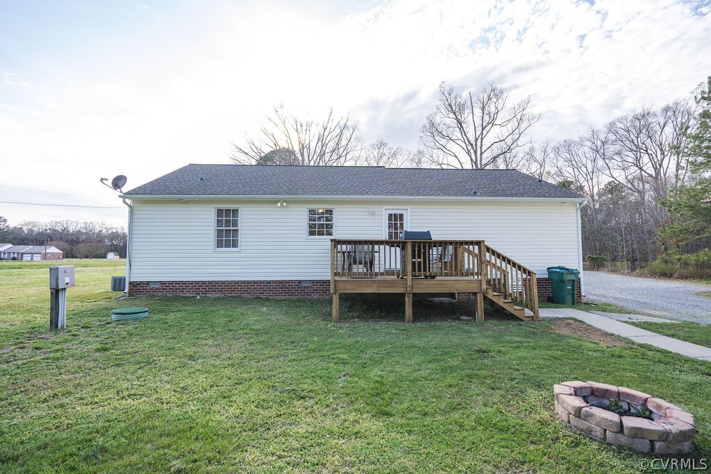 8681 Strath Road Henrico, VA 23231 - Photo 3 of 29 a backyard of a house with table and chairs