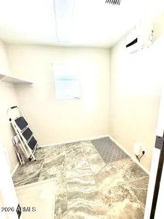 a bathroom with a double vanity sink toilet mirror and bathtub