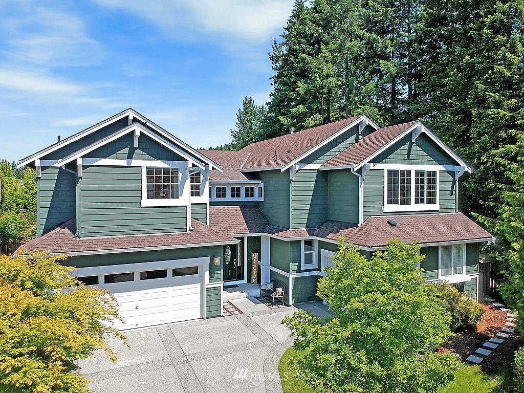 27712 Maple Ridge Way Southeast Maple Valley, WA 98038 - Photo 1 of 36 a house view with a garden