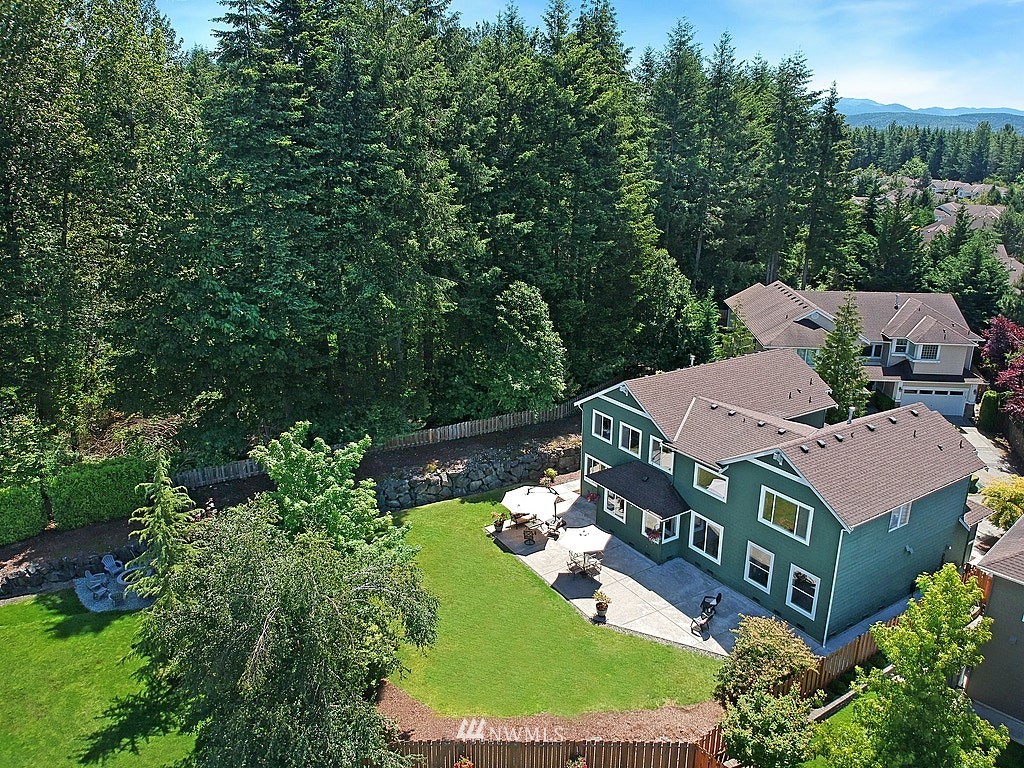 27712 Maple Ridge Way Southeast Maple Valley, WA 98038 - Photo 3 of 36 an aerial view of a house with a garden