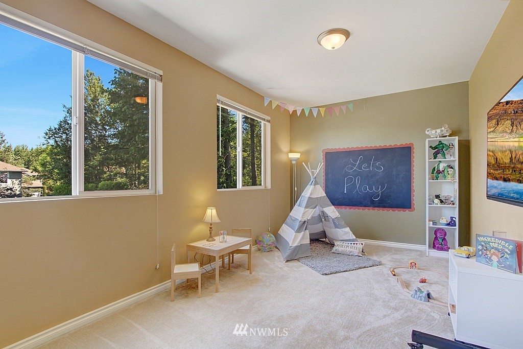 27712 Maple Ridge Way Southeast Maple Valley, WA 98038 - Photo 28 of 36 a living room with furniture and a window