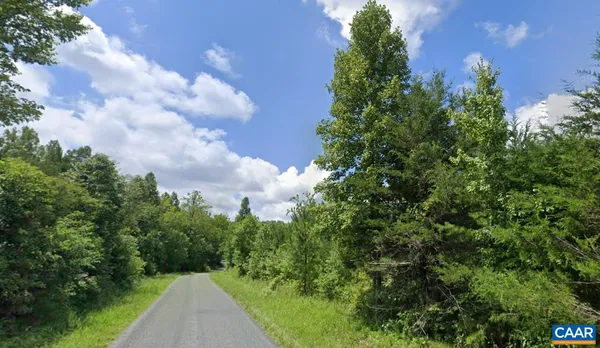a view of a city street with a building in the background