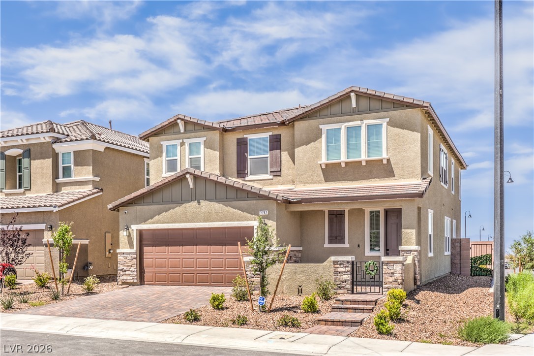 3782 Alla Rocca Avenue Henderson, NV 89044 - Photo 2 of 55 This modern home features an attached garage, inviting entrance, and well-maintained landscaping.