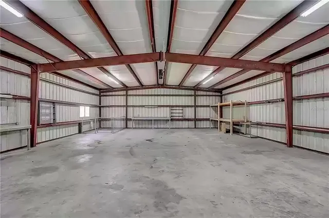 a kitchen with stainless steel appliances granite countertop a refrigerator a sink a stove a microwave and island