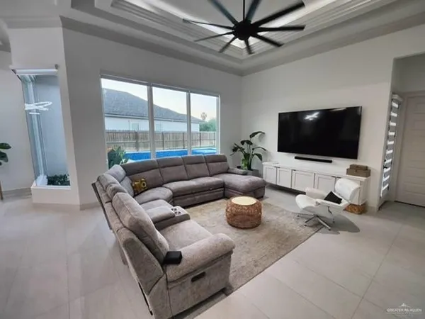 a living room with furniture and a flat screen tv
