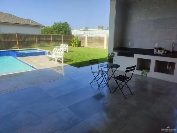 a view of a backyard with a patio