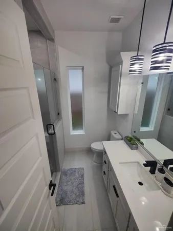 a bathroom with a sink a toilet and a tub