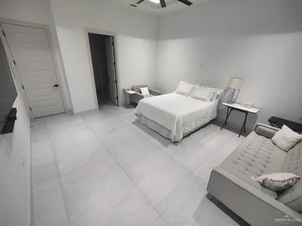 a bedroom with a bed and cabinets