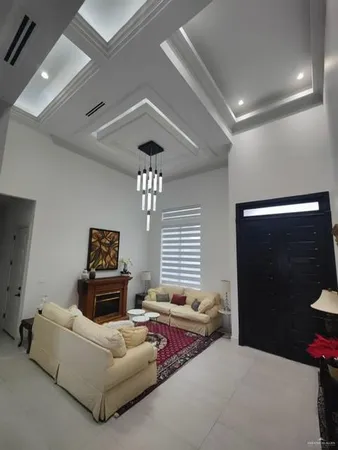 a bedroom with furniture and a ceiling fan