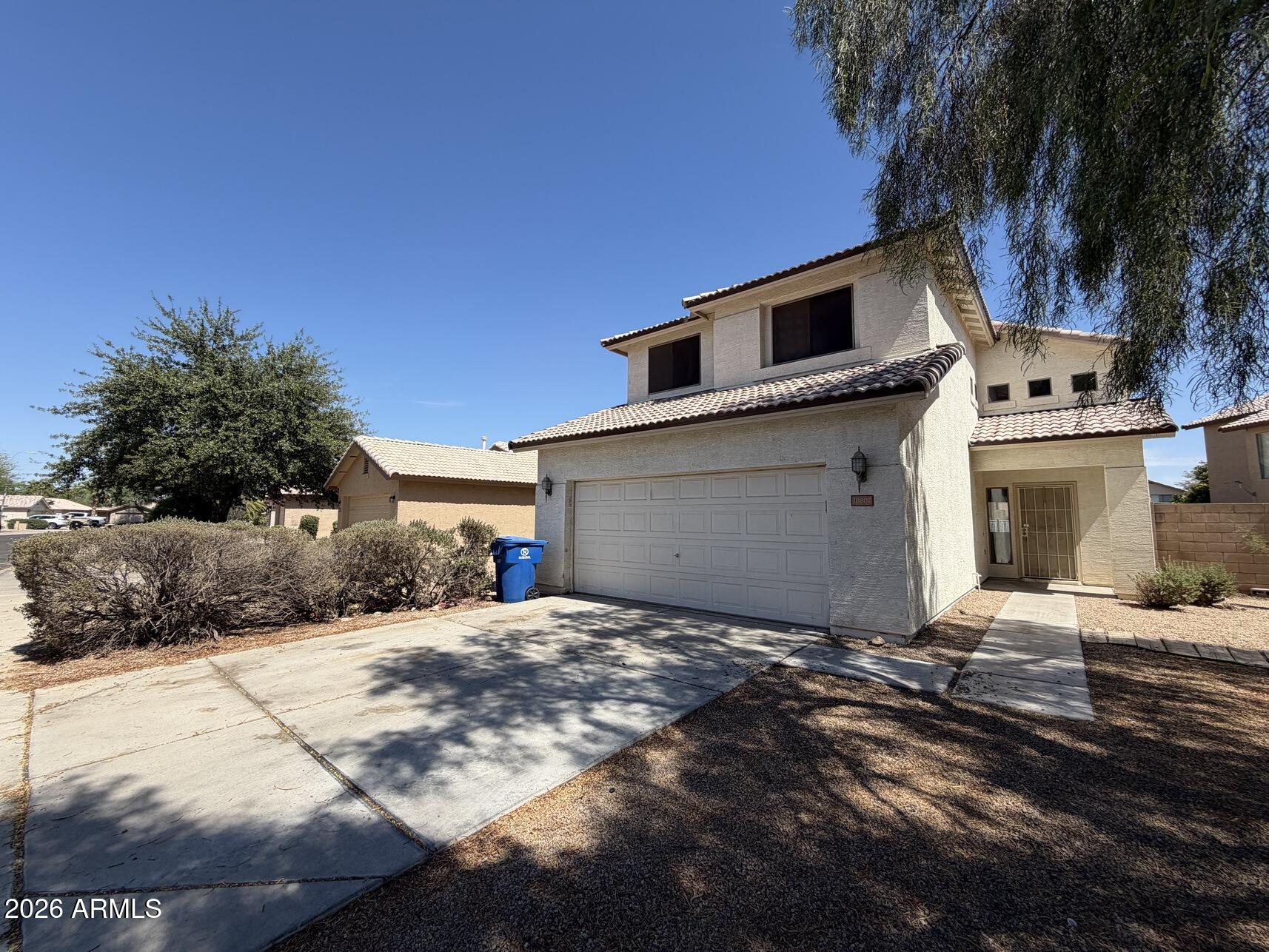 10807 West Monte Vista Road Avondale, AZ 85392 - Photo 2 of 33 a view of a house with a yard