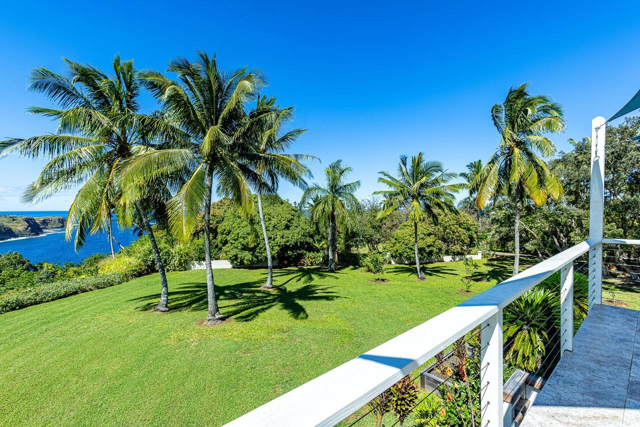 555 North Holokai Road Haiku, HI 96708 - Photo 25 of 50 The private upper-level deck provides an incredible view of swaying palms on the large lawn