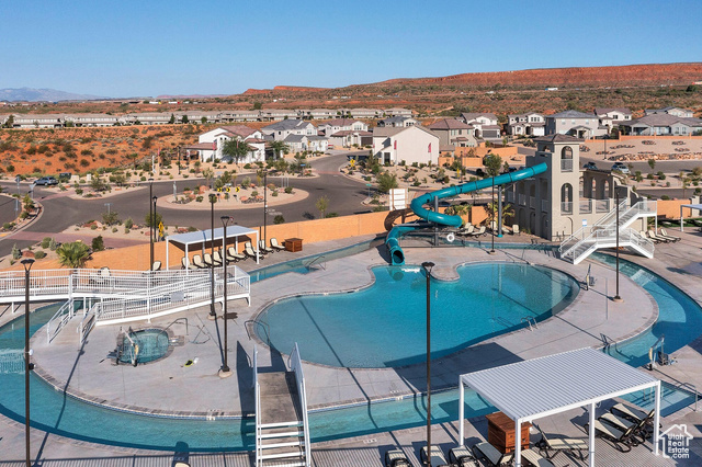1329 Paseos Street Washington, UT 84780 - Photo 28 of 35 Community pool featuring a water slide, a patio, and a residential view