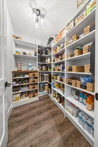 a bedroom with a bed and a television