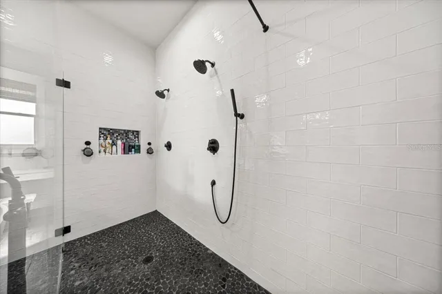 a view of a storage and utility room with washer and dryer