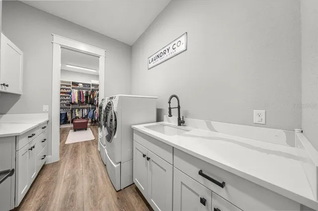 a bathroom with a double vanity sink mirror and