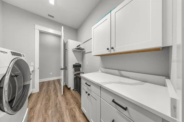 a white toilet sitting next to a bath tub