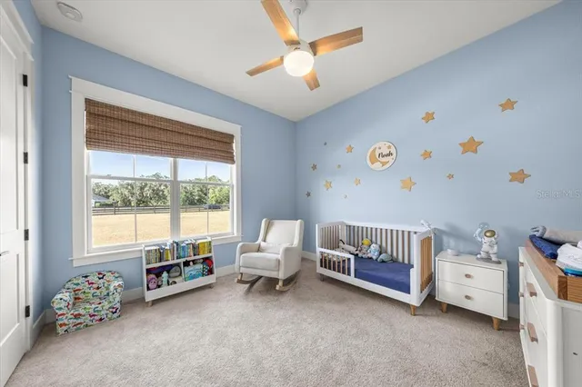 a view of a room with gym equipment and a window