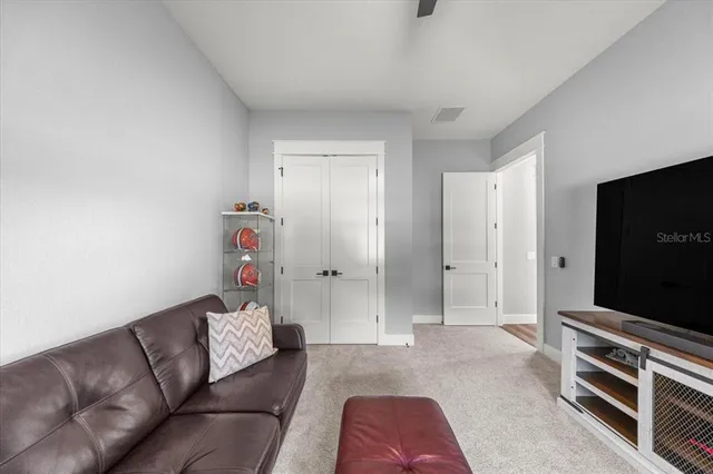 a view of a porch with furniture and garden