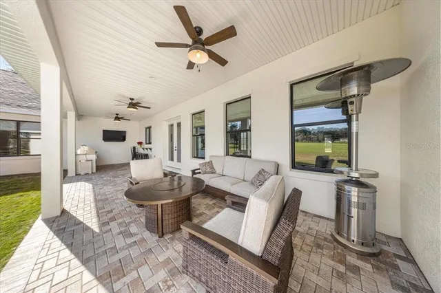 a view of a swimming pool with a lot of trees in the background