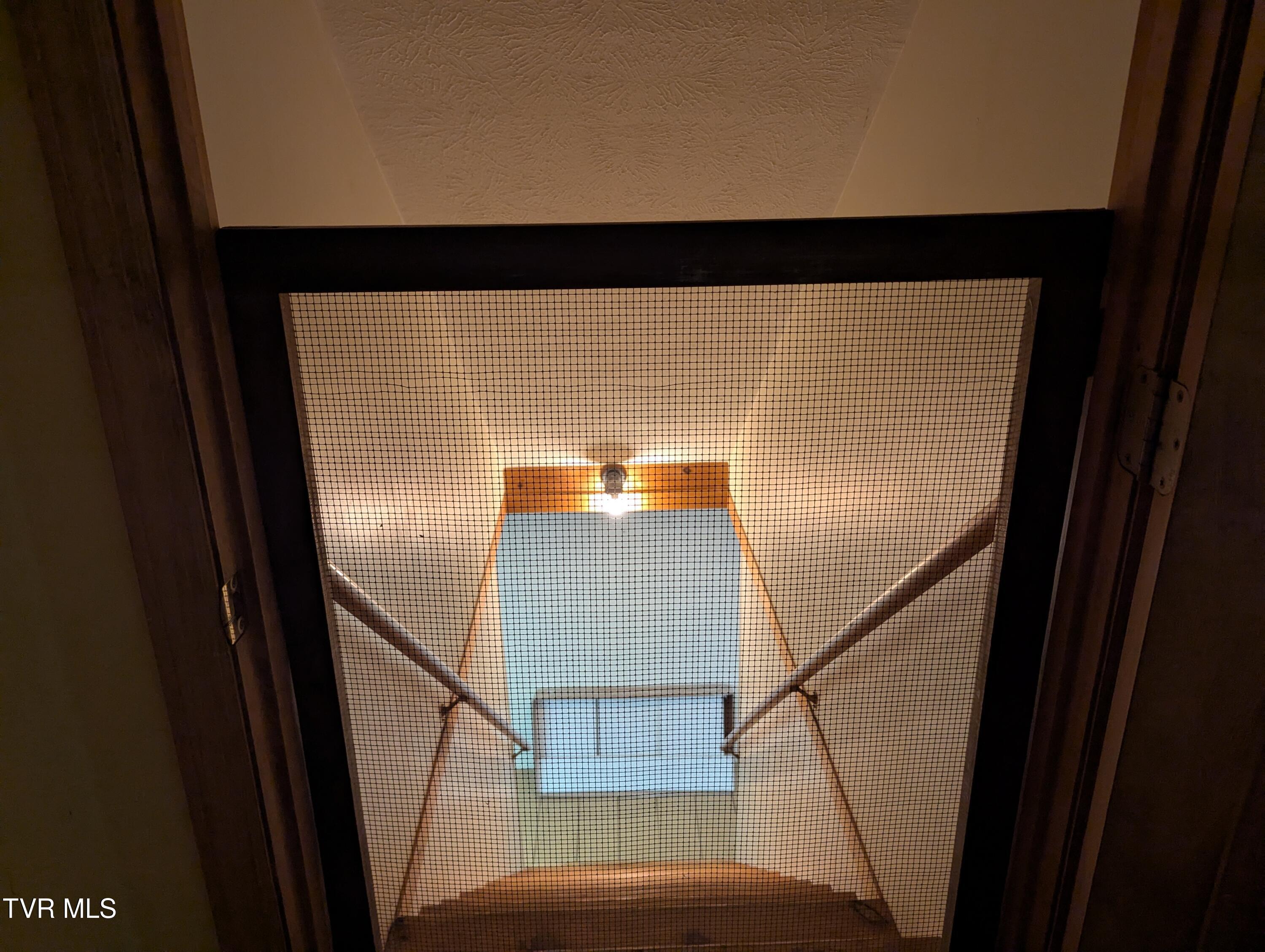 1473 Oasis Road Bulls Gap, TN 37711 - Photo 98 of 143 Screen door at basement stairs