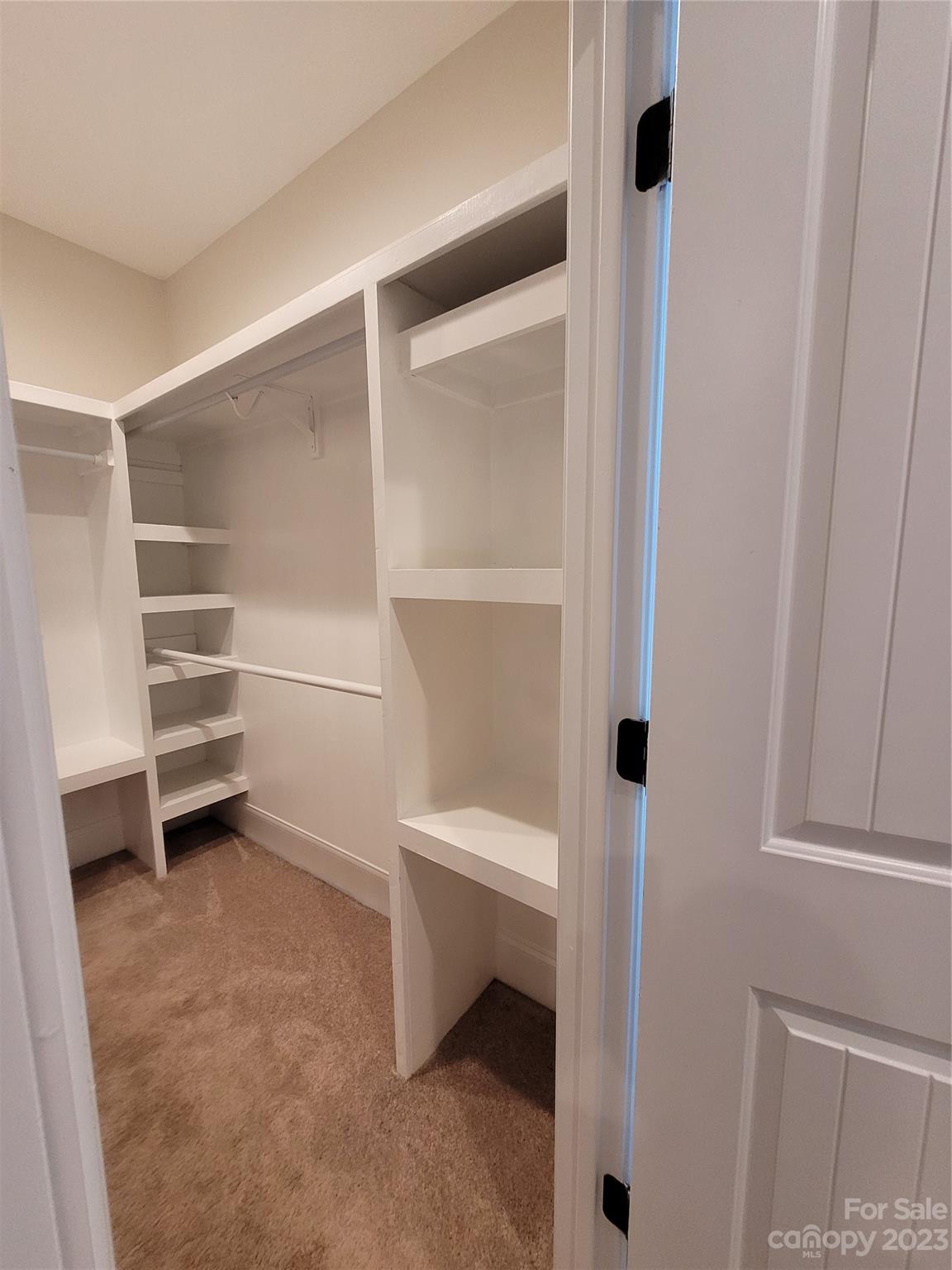 2775 Beechwood Road Denver, NC 28037 - Photo 16 of 26 a room with walk in closet and a white cabinet