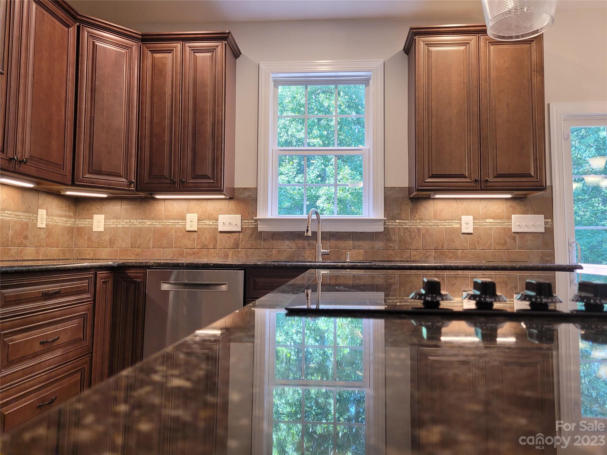 2775 Beechwood Road Denver, NC 28037 - Photo 24 of 26 a kitchen with large window a sink and a counter space