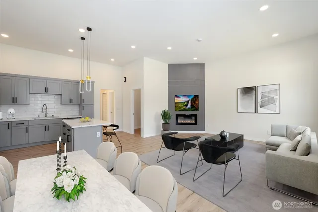 a living room with kitchen island furniture and a wooden floor