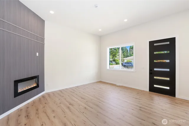 an empty room with windows and closet