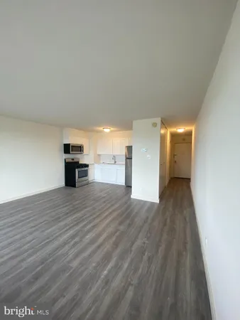 a view of empty room with a fireplace
