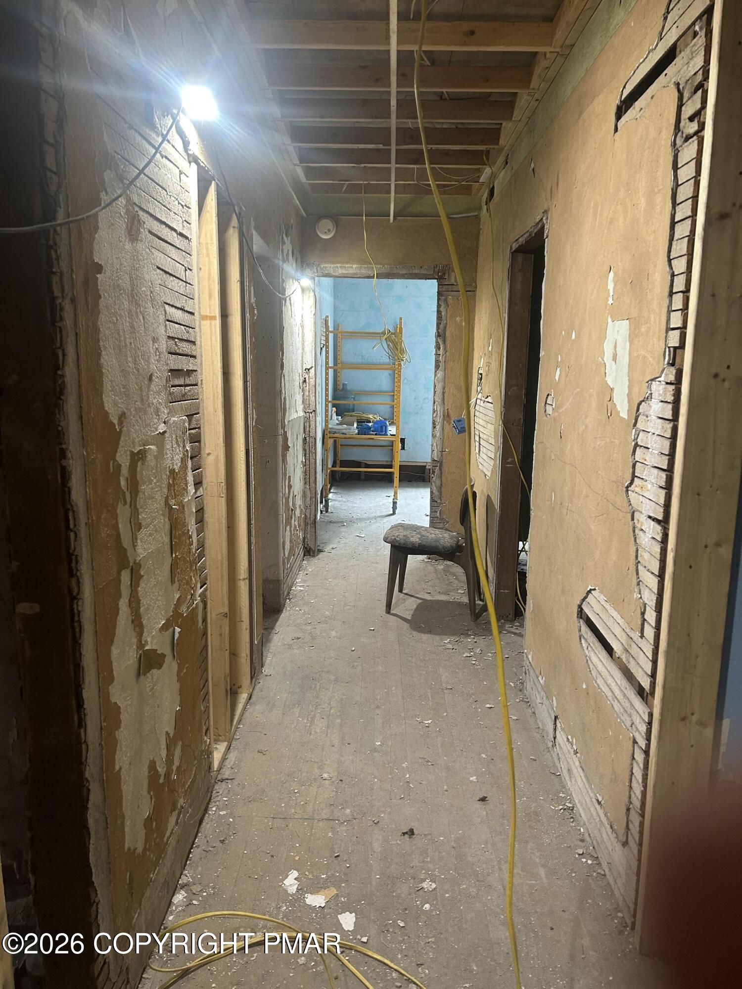 216 East Main Street Glen Lyon, PA 18617 - Photo 11 of 21 a view of a hallway with wooden floor and windows
