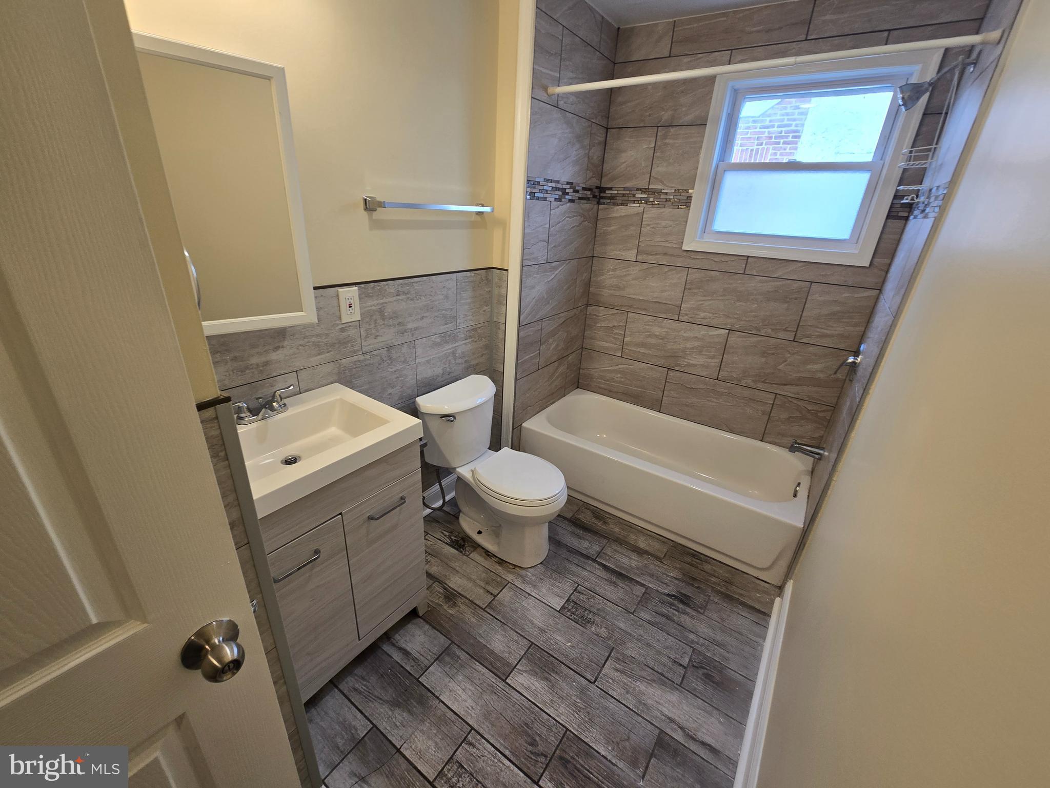 915 MacDade Boulevard Collingdale, PA 19023 - Photo 11 of 15 a bathroom with a sink a toilet and shower
