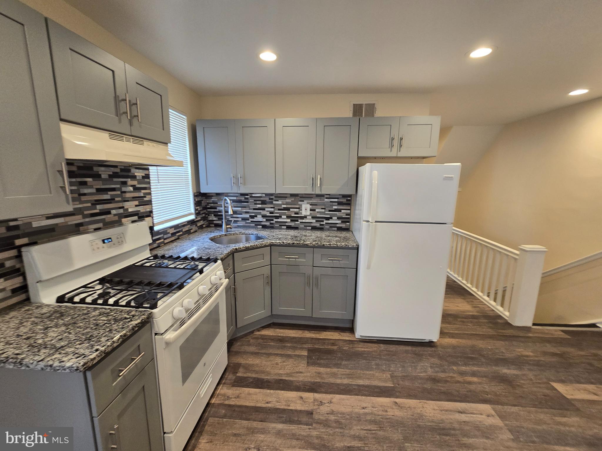 915 MacDade Boulevard Collingdale, PA 19023 - Photo 5 of 15 a kitchen with a stove a refrigerator and a sink