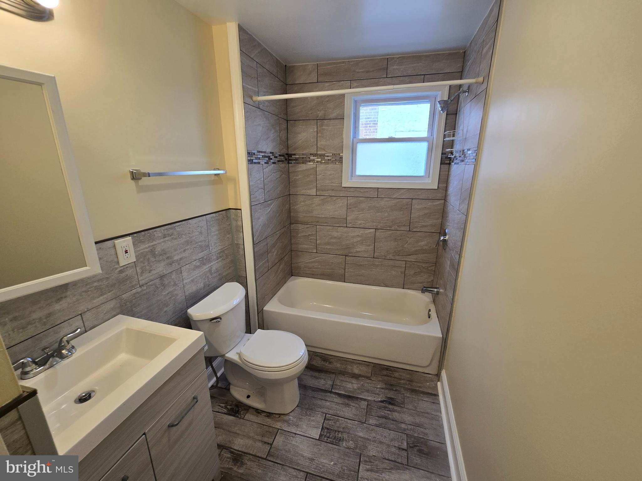 915 MacDade Boulevard Collingdale, PA 19023 - Photo 6 of 15 a bathroom with a sink toilet and shower