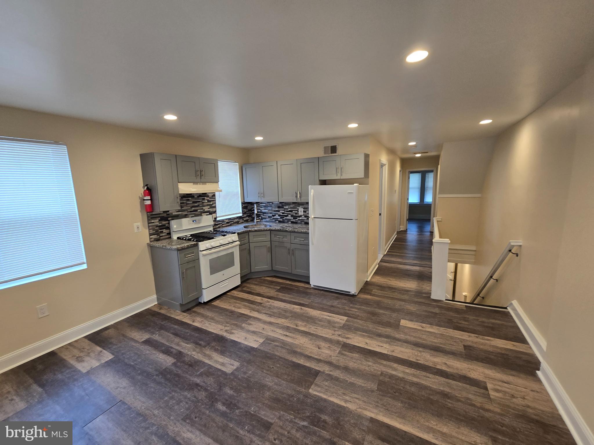 915 MacDade Boulevard Collingdale, PA 19023 - Photo 7 of 15 a kitchen with a sink and refrigerator
