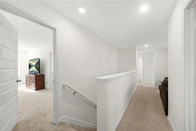 a view of hallway with livingroom and furniture