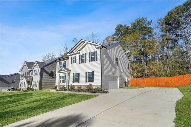 front view of a house with a yard