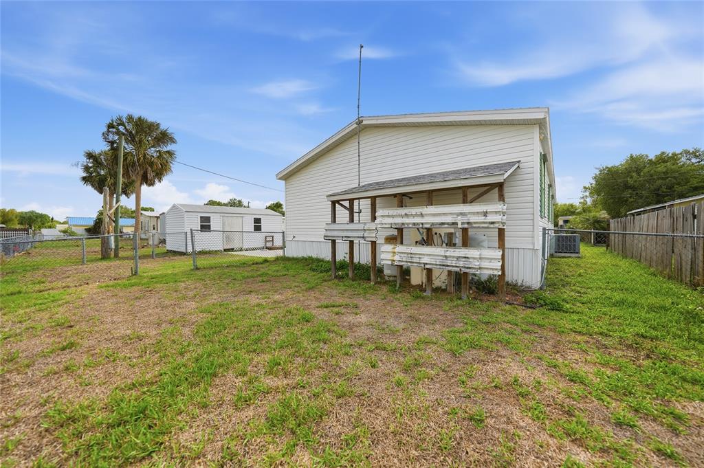 11923 Southwest Loop Terrace Arcadia, FL 34269 - Photo 39 of 50 a view of house with backyard and deck