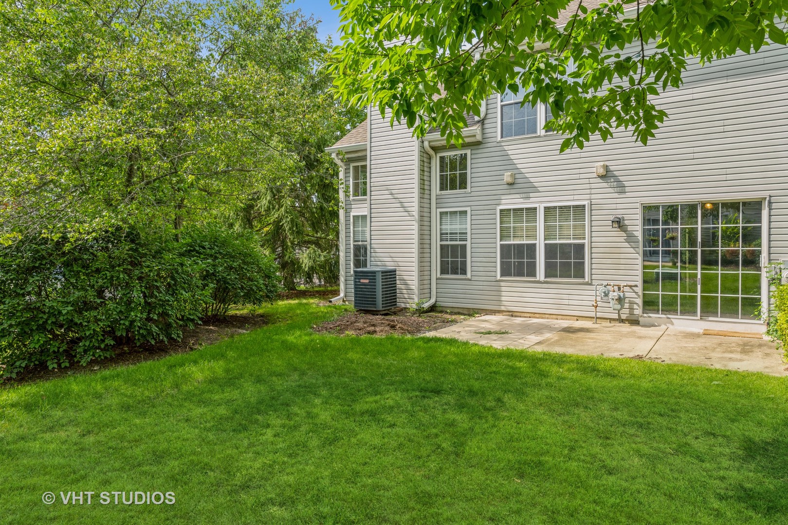 125 Parkview Drive Wauconda, IL 60084 - Photo 14 of 14 a backyard of a house with plants and large tree