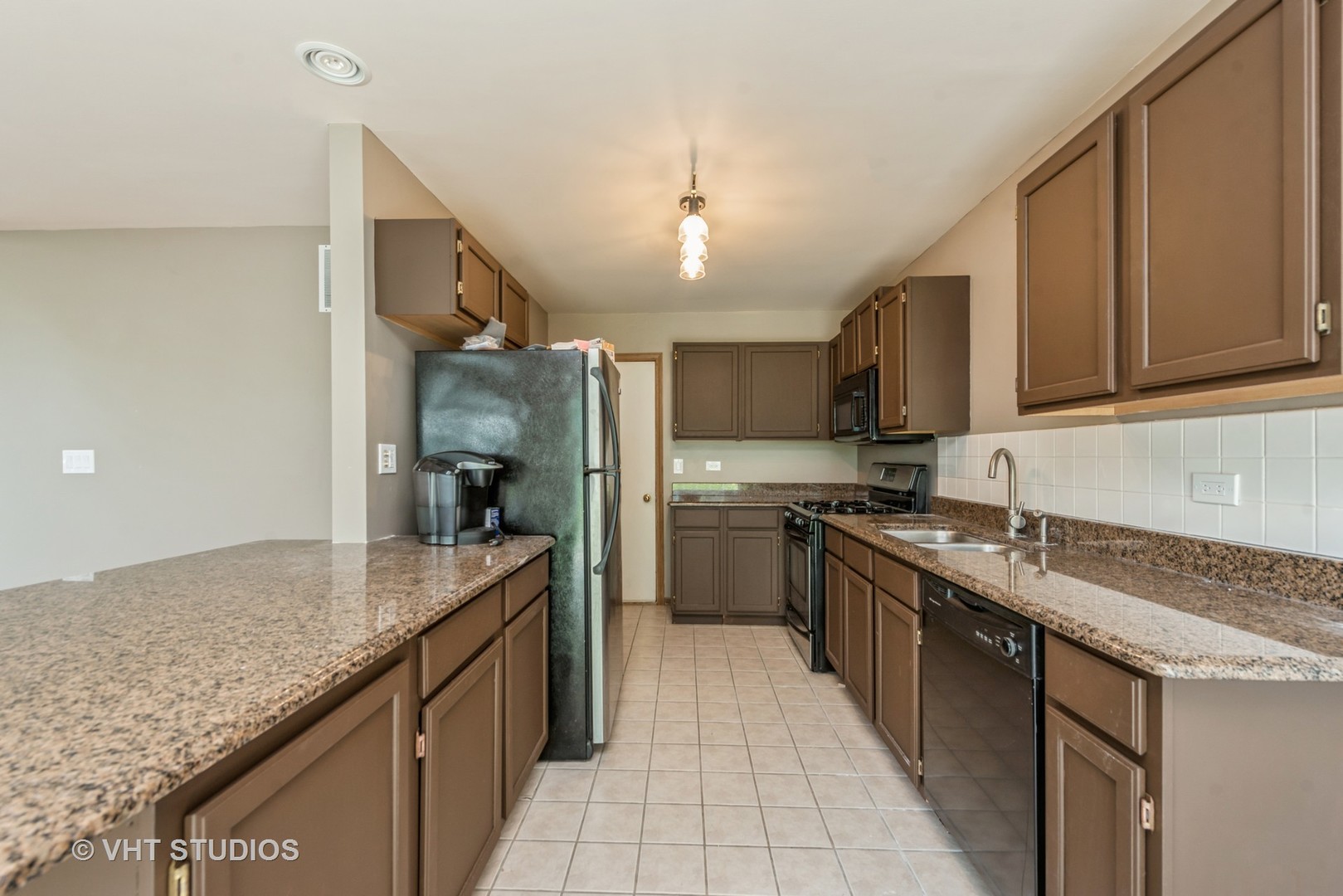 125 Parkview Drive Wauconda, IL 60084 - Photo 5 of 14 a kitchen with stainless steel appliances granite countertop a sink stove and refrigerator